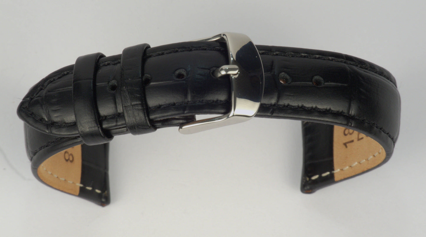 Lederuhrenarmband (Schwarz) zu einem Bogen geformt mit weißem Hintergrund. Detaillierte Nahaufnahme.