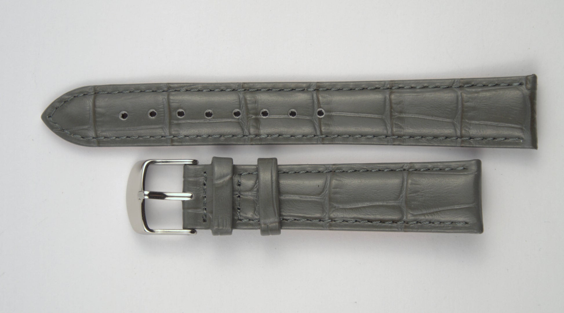 Lederuhrenarmband (Dunkelgrau) flach aufgelegt mit weißem Hintergrund. Detaillierte Nahaufnahme.